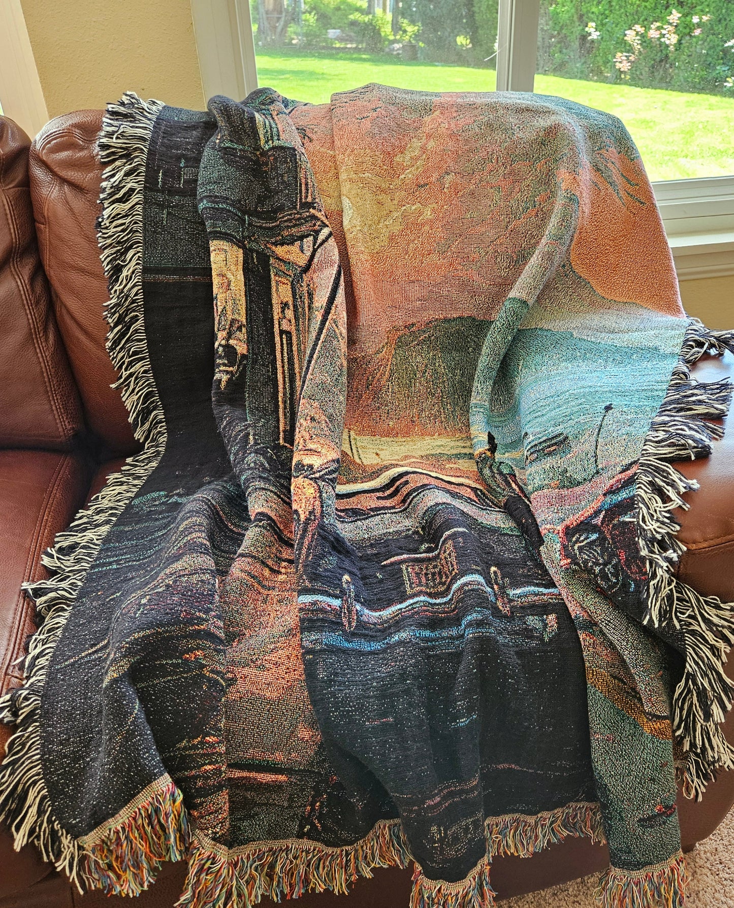 Man walking by a car under rain depicted on the Reflections in the Rain woven blanket from Artifact1337, showcasing luxury and intricate weaving.