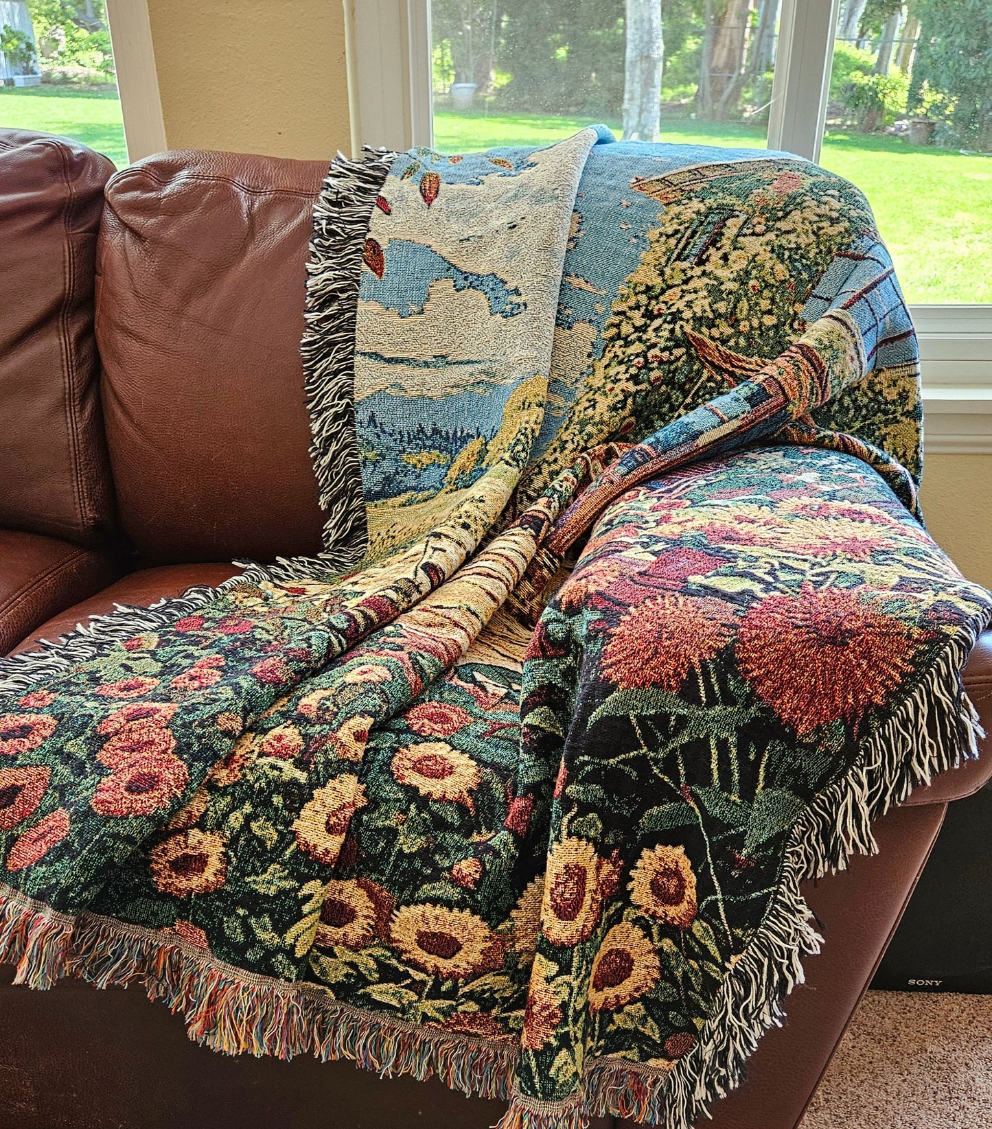 Bohemian Sunflower House woven blanket featuring a house and sunflowers, crafted from 100% cotton, ideal as a luxurious home decor piece.