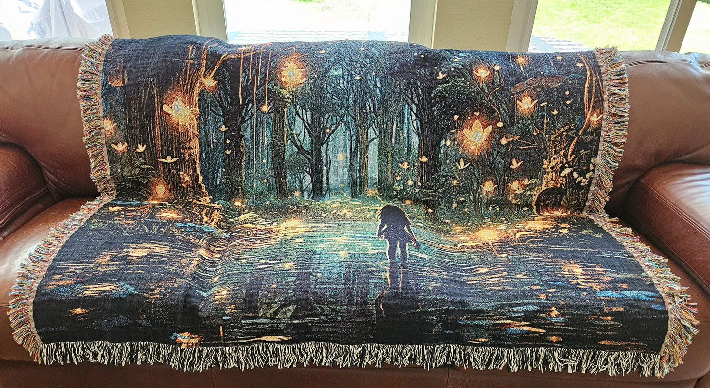 Woven blanket featuring Forest of Magic design, depicting a girl in a lit forest, blending art and luxury for home decor.