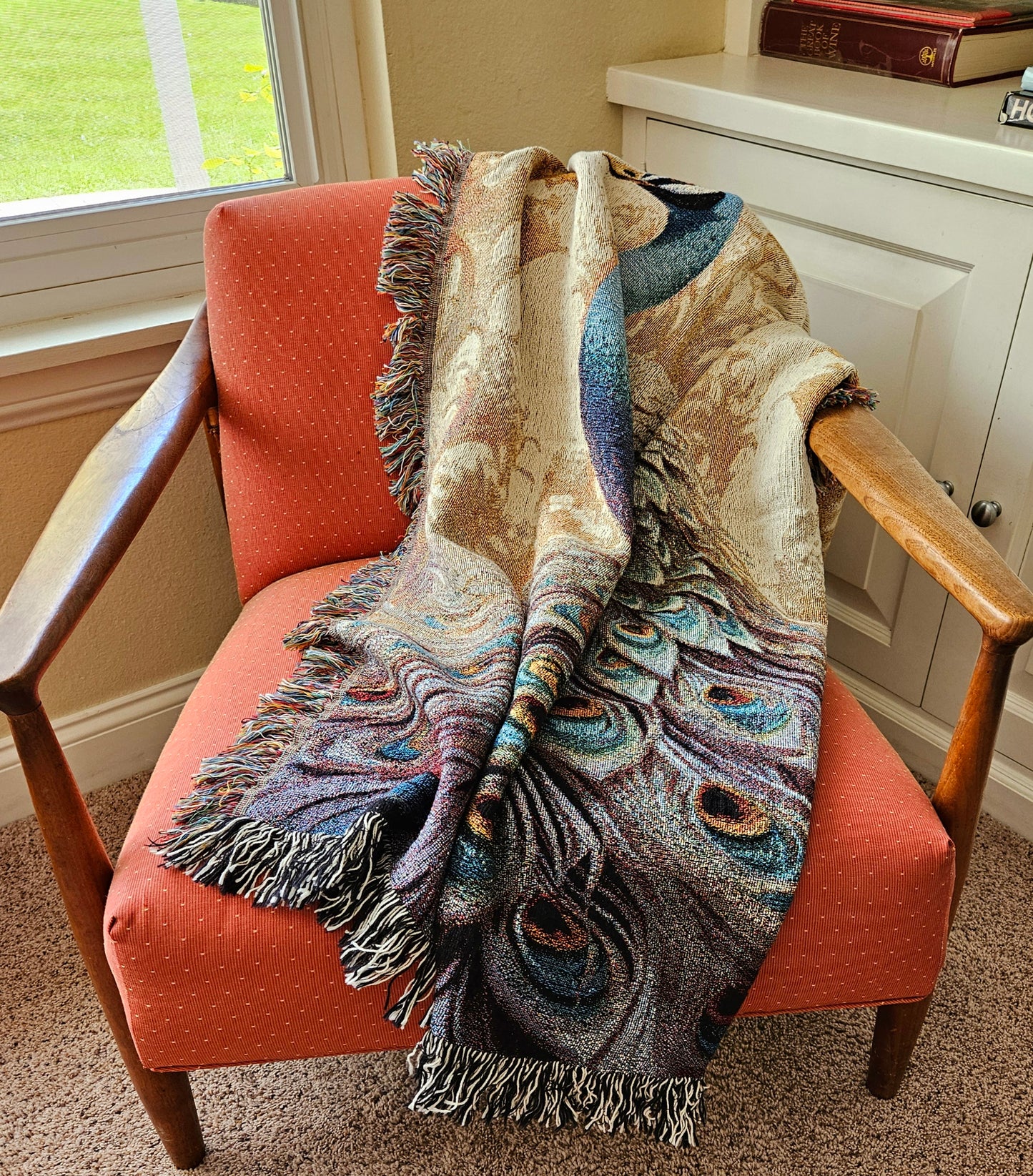 The Peacock Emperor woven blanket showcases a detailed peacock design, highlighting luxurious craftsmanship ideal for enhancing home décor.