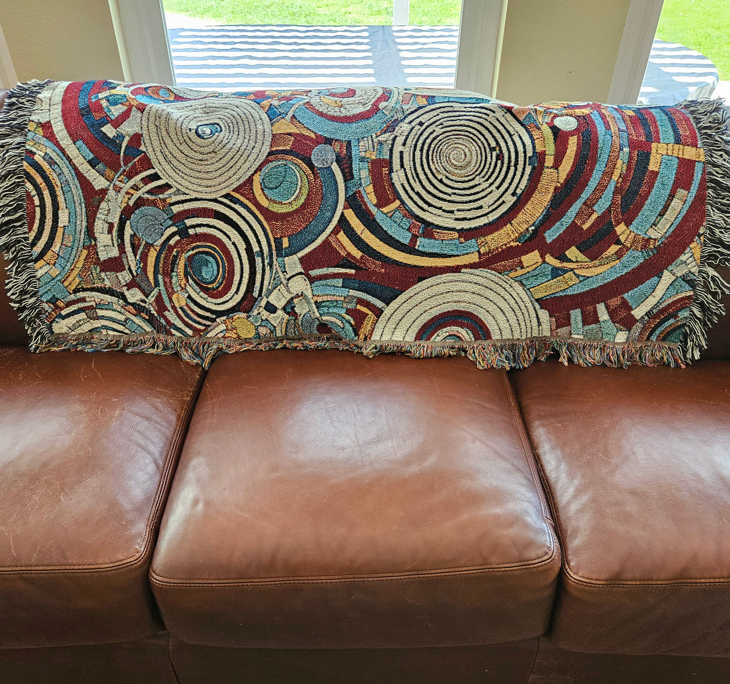 Spiral Abstraction I Woven Blanket featuring a vibrant pattern, showcasing artistic motifs, made from 100% pure cotton for a luxurious touch.
