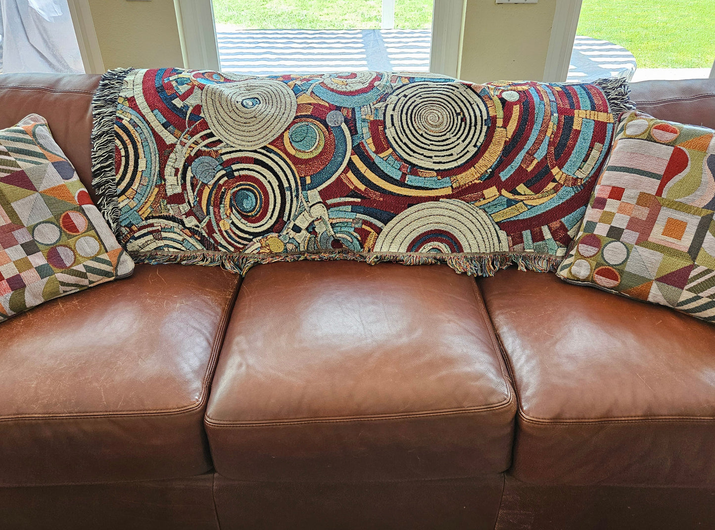 Spiral Abstraction I Woven Blanket featuring a vibrant pattern, showcasing artistic motifs, made from 100% pure cotton for a luxurious touch.