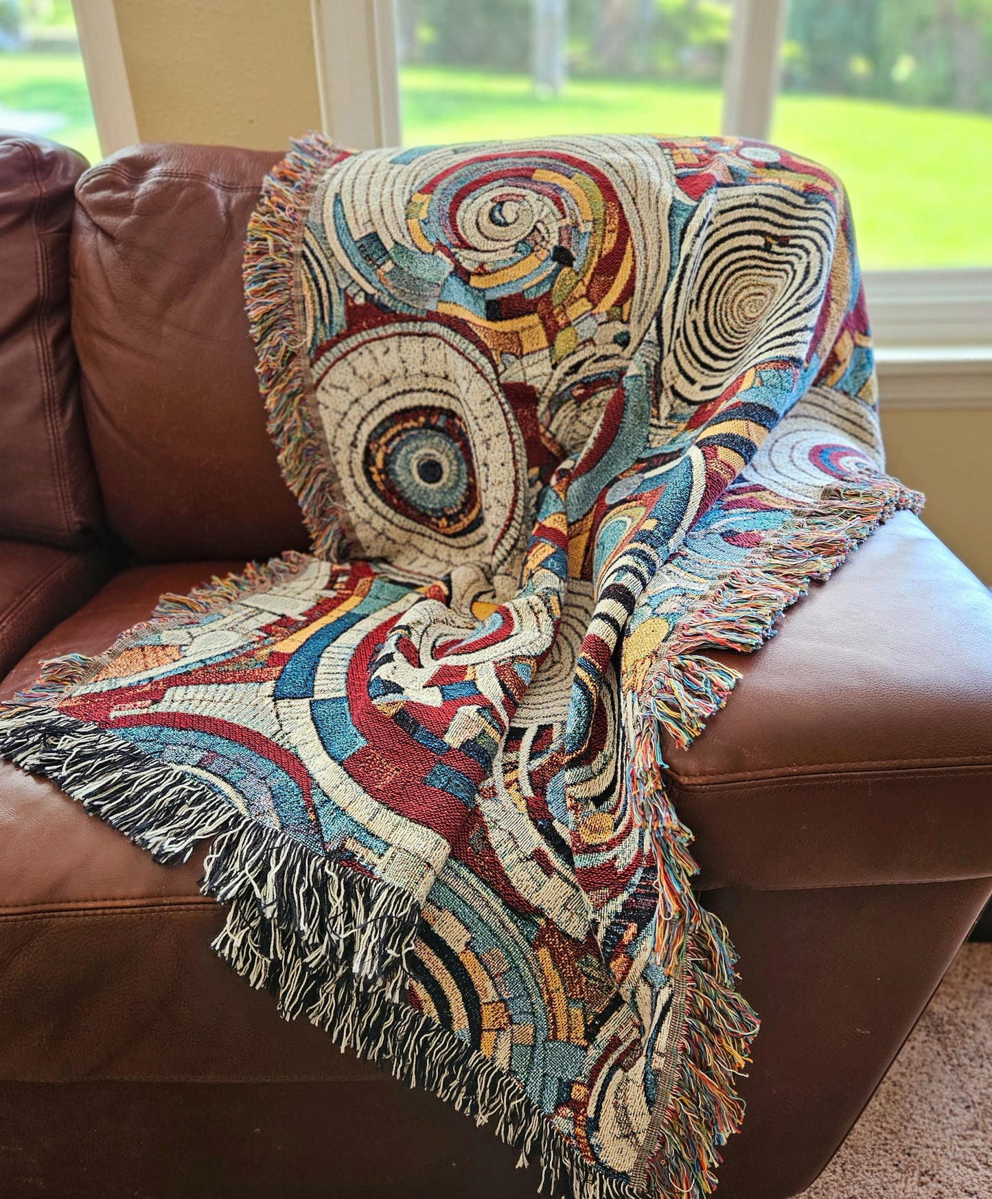 Spiral Abstraction I Woven Blanket featuring a vibrant pattern, showcasing artistic motifs, made from 100% pure cotton for a luxurious touch.