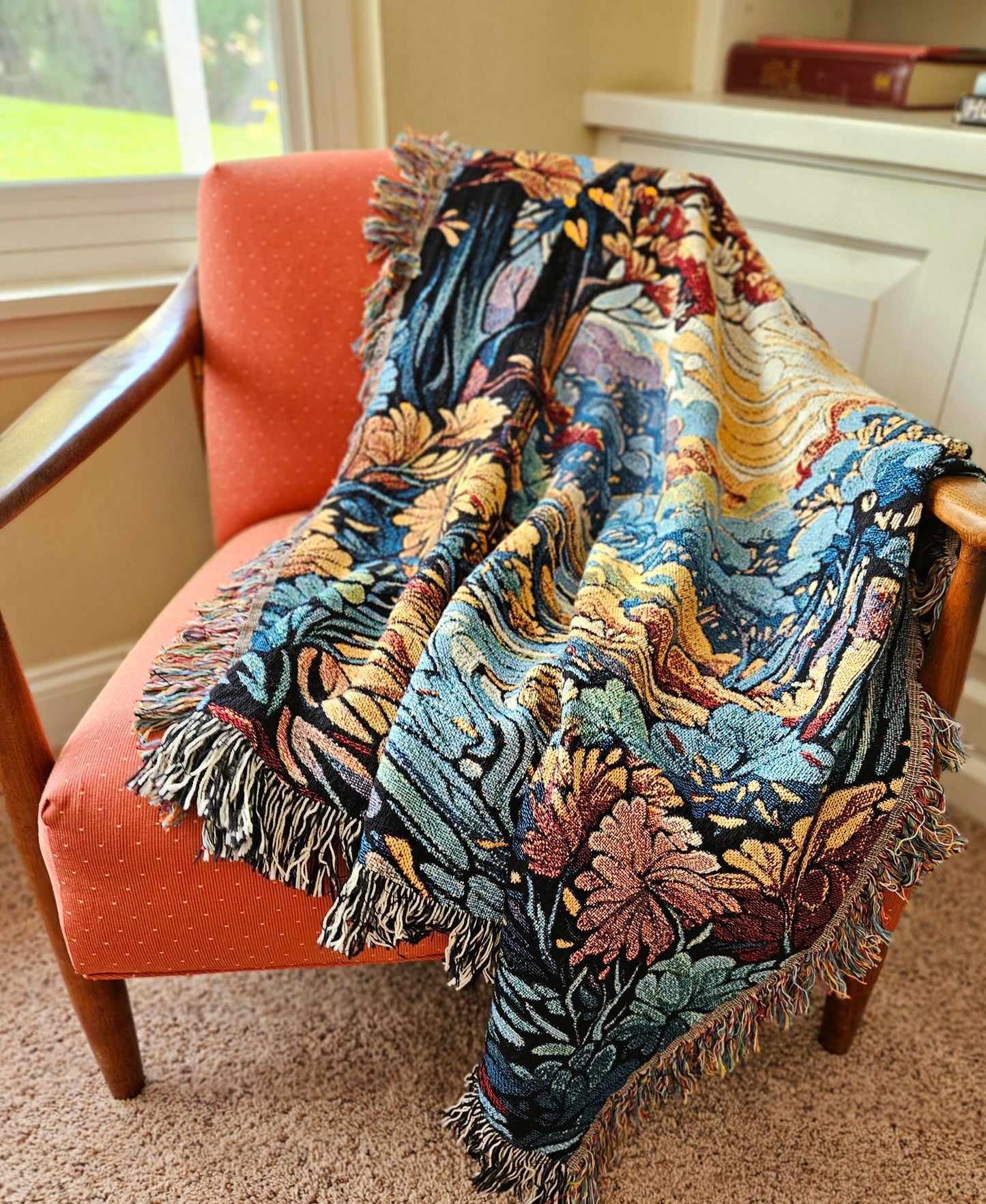 Flowing Serenity Woven Blanket featuring a colorful tapestry of trees and a river, highlighting its luxurious, intricate design.