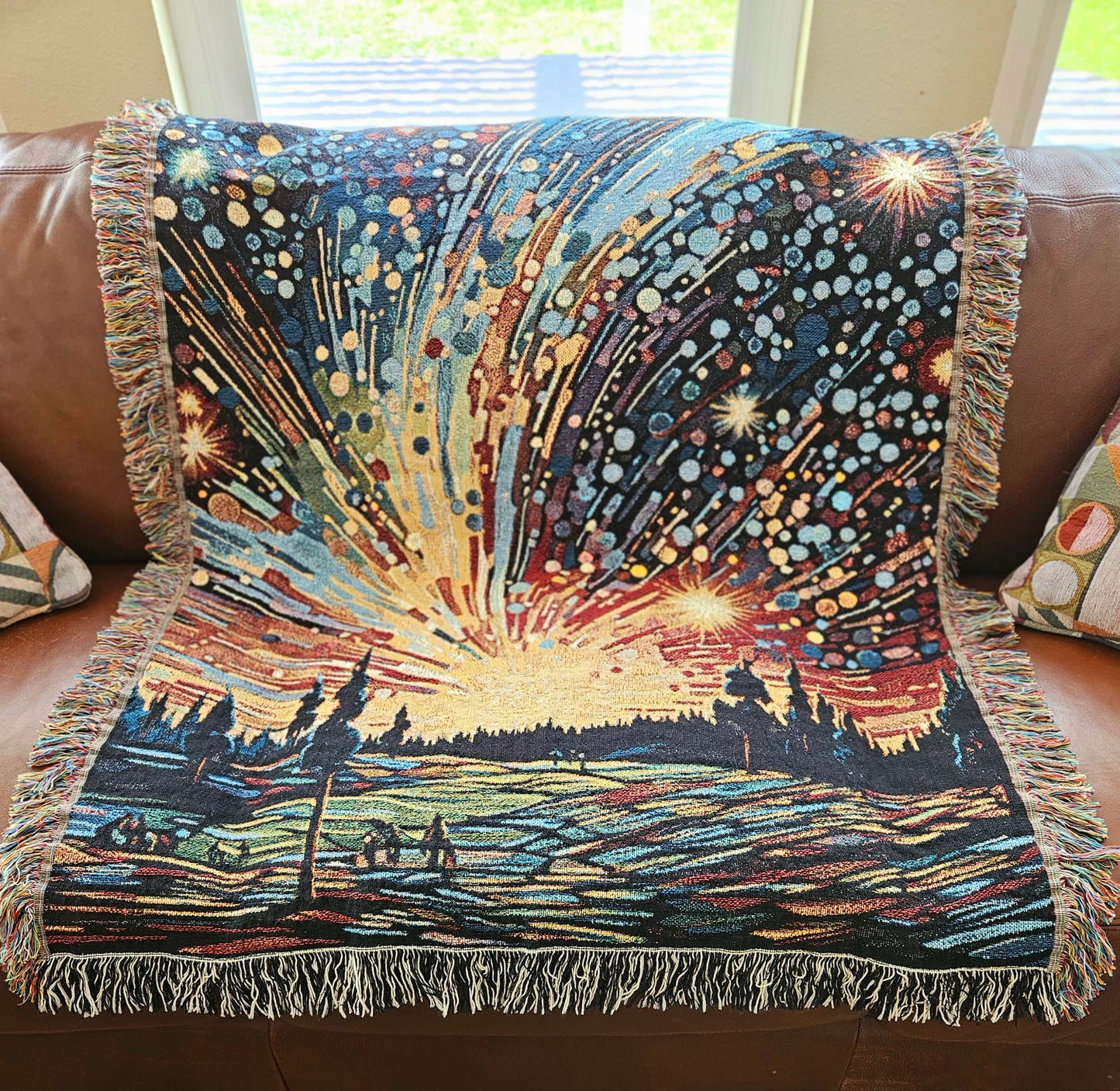 Meteor Shower Woven Blanket featuring an artful depiction of fireworks, adding luxury and personality to your home décor with 100% pure cotton craftsmanship.