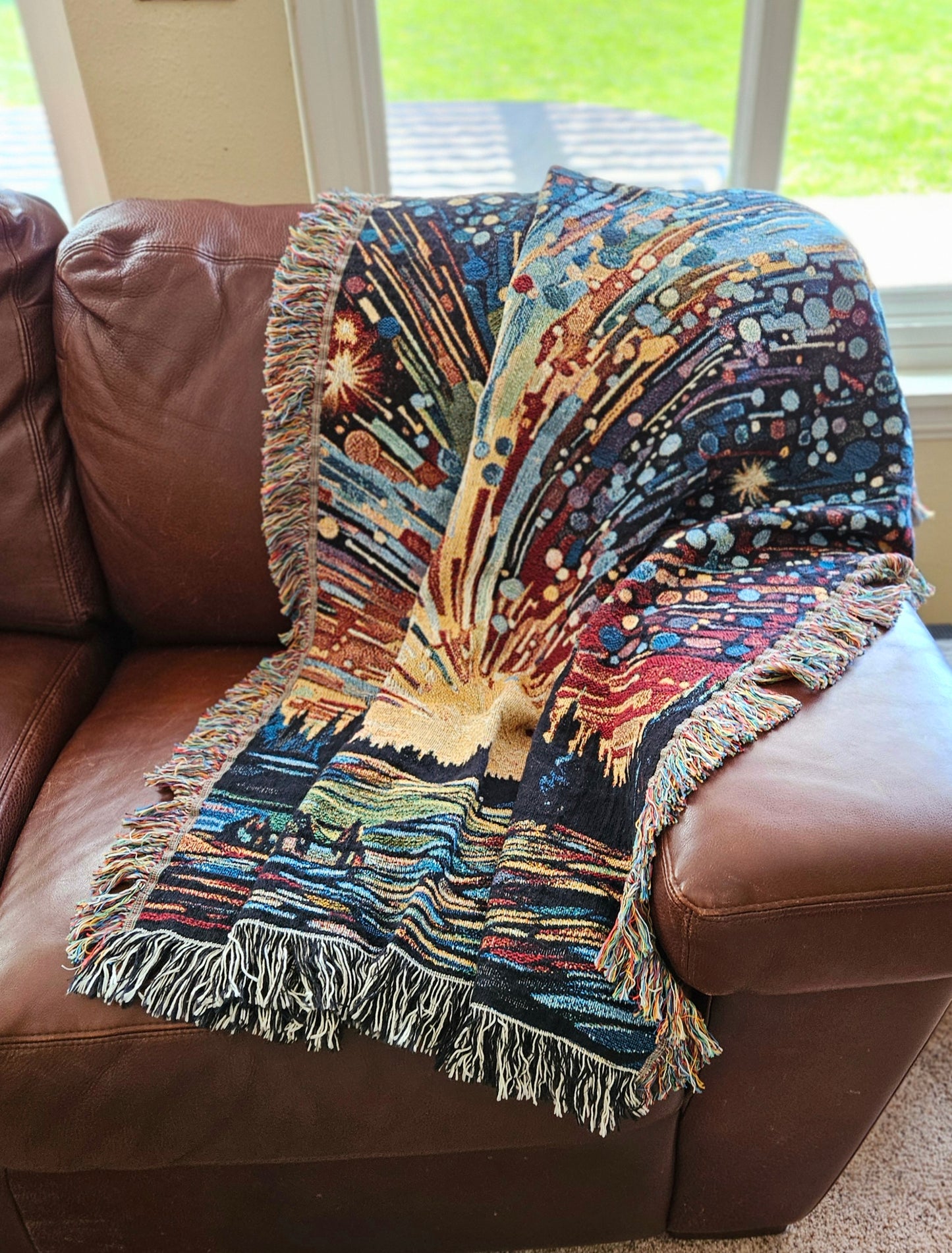 Meteor Shower Woven Blanket featuring an artful depiction of fireworks, adding luxury and personality to your home décor with 100% pure cotton craftsmanship.