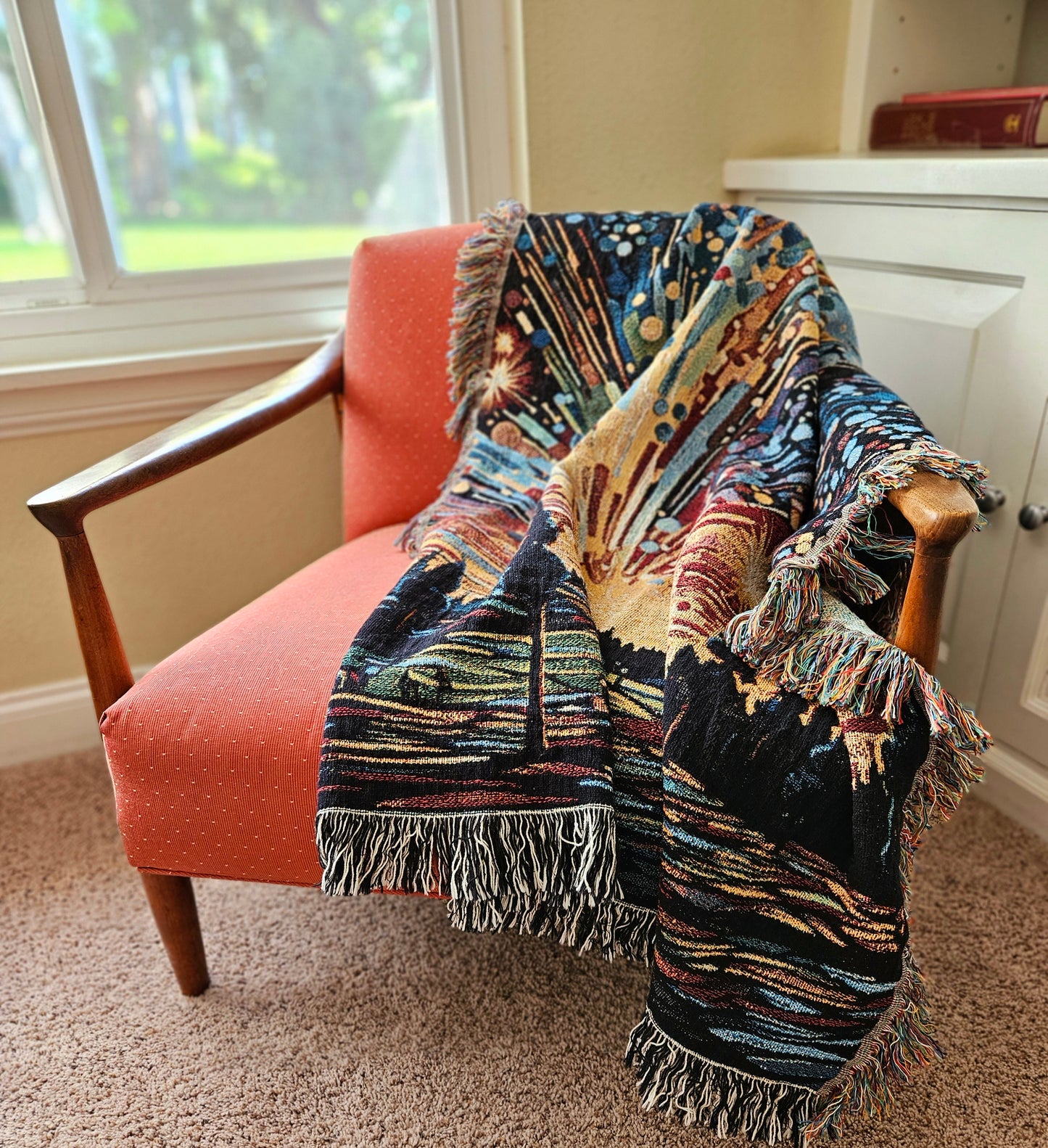 Meteor Shower Woven Blanket draped over a chair, showcasing its luxurious texture and intricate design, perfect for adding elegance to any room.