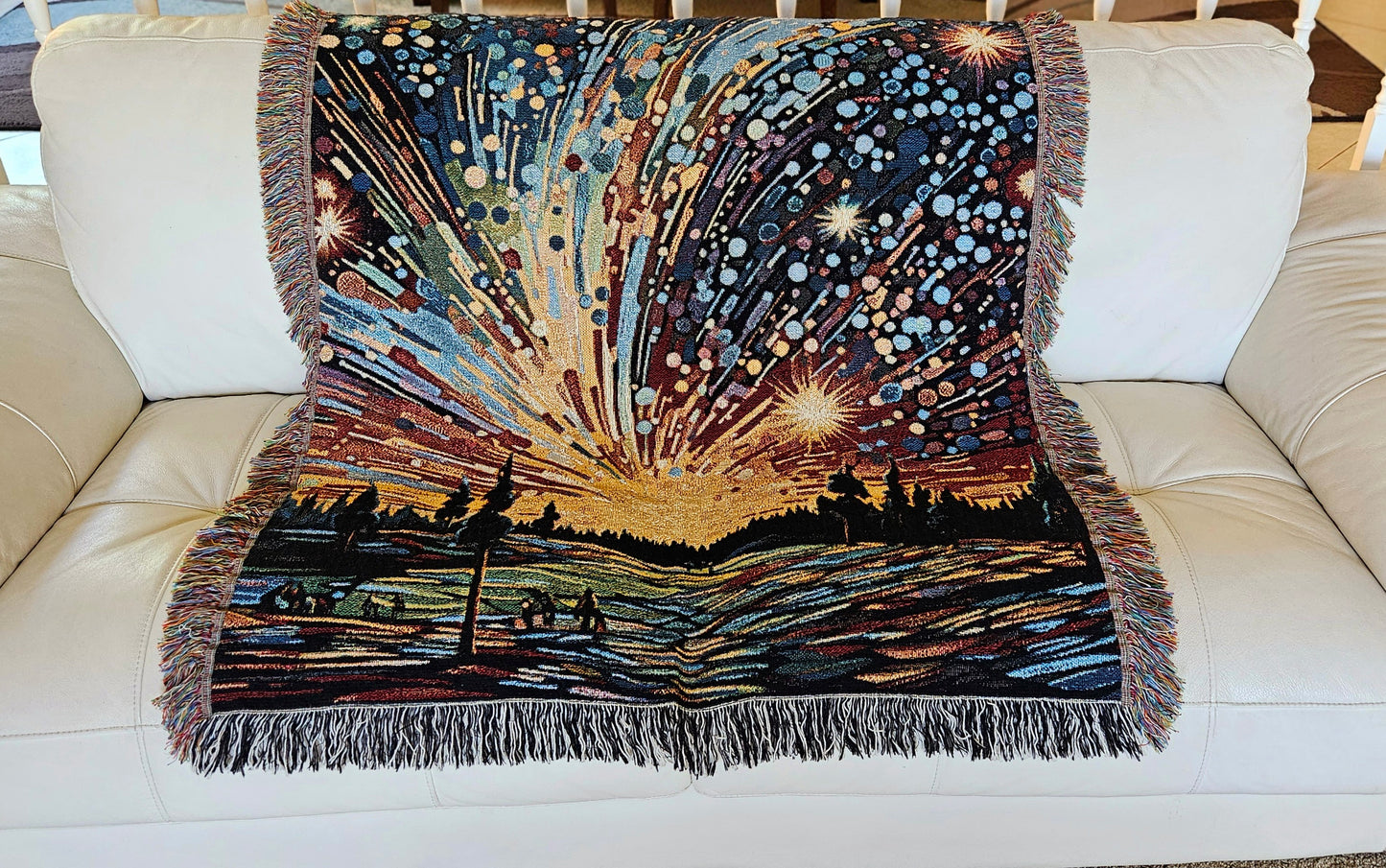 Meteor Shower Woven Blanket featuring an artful depiction of fireworks, adding luxury and personality to your home décor with 100% pure cotton craftsmanship.