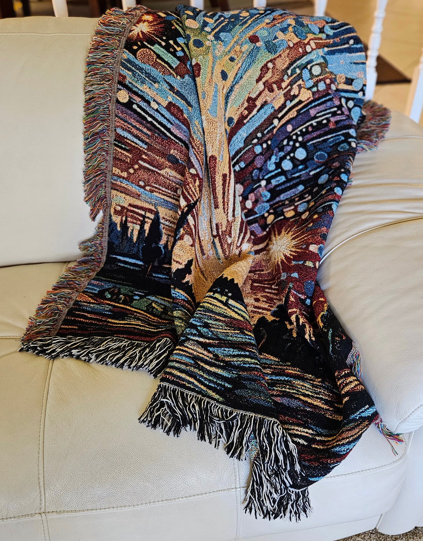Meteor Shower Woven Blanket featuring an artful depiction of fireworks, adding luxury and personality to your home décor with 100% pure cotton craftsmanship.