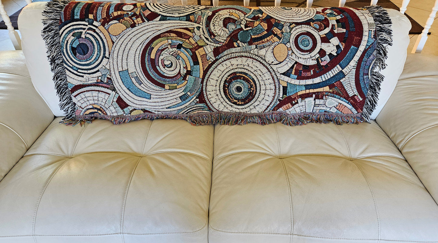 Spiral Abstraction I Woven Blanket featuring a vibrant pattern, showcasing artistic motifs, made from 100% pure cotton for a luxurious touch.