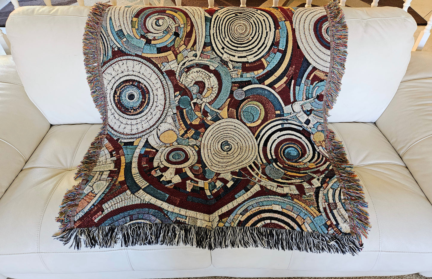 Spiral Abstraction I Woven Blanket featuring a vibrant pattern, showcasing artistic motifs, made from 100% pure cotton for a luxurious touch.