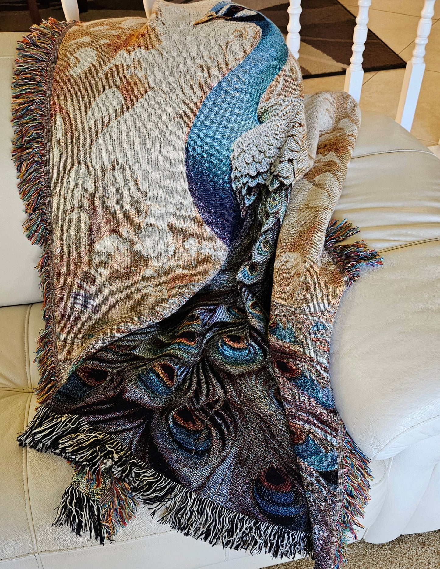 The Peacock Emperor woven blanket showcases a detailed peacock design, highlighting luxurious craftsmanship ideal for enhancing home décor.