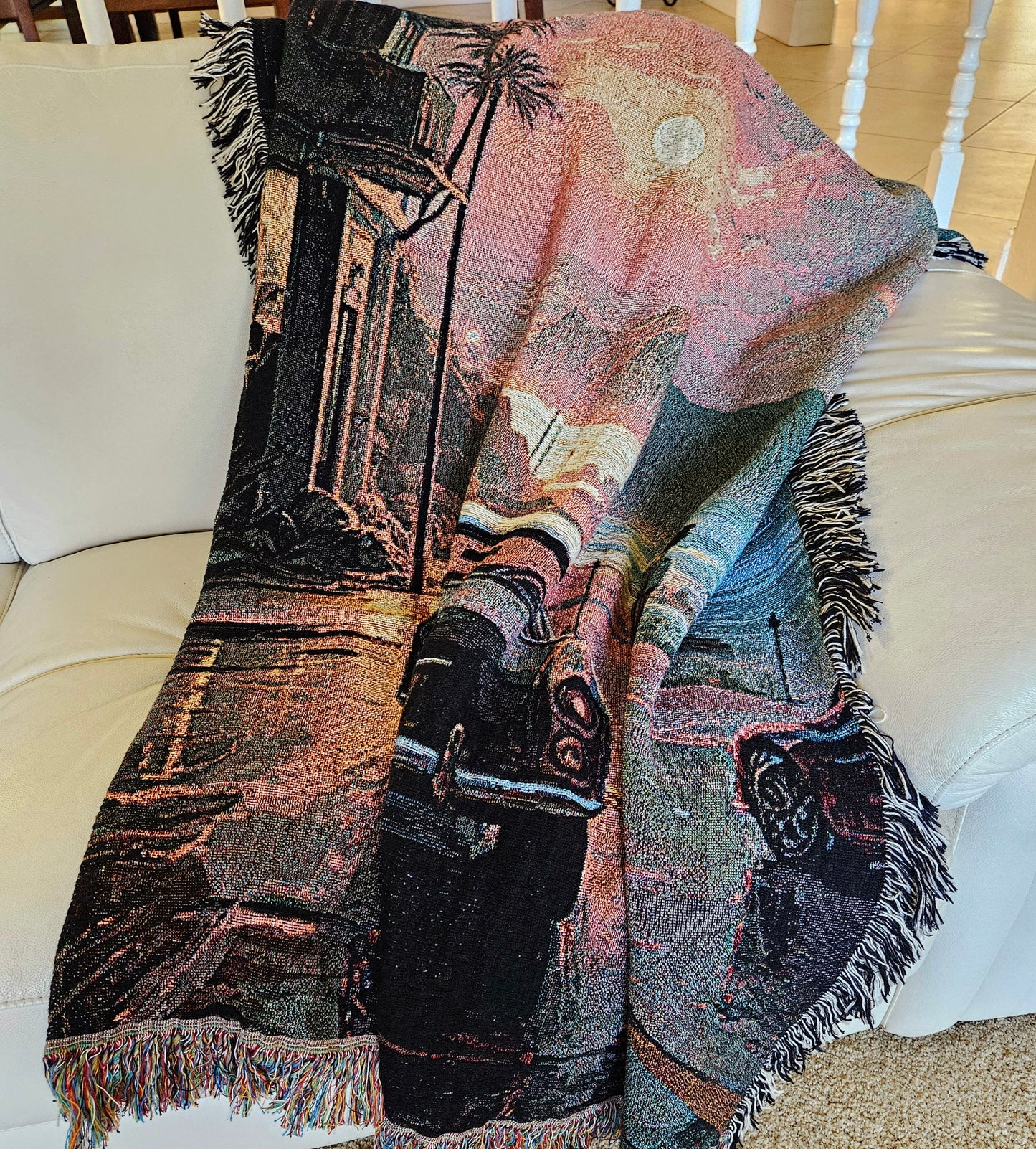 Man walking by a car under rain depicted on the Reflections in the Rain woven blanket from Artifact1337, showcasing luxury and intricate weaving.