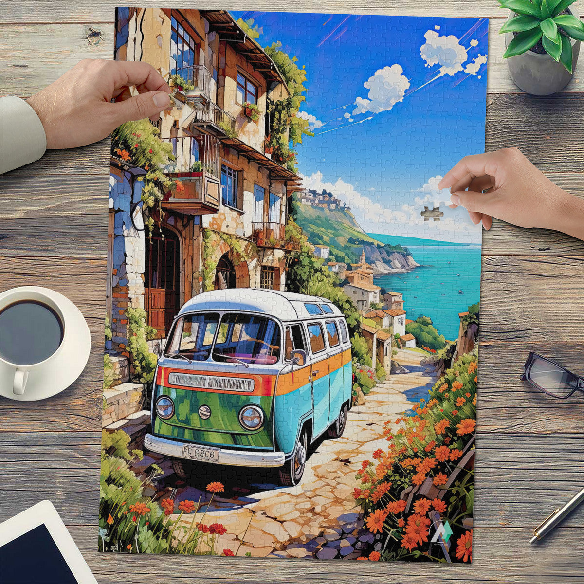 Van Life on the Med Puzzle, featuring a bus van on a scenic road, available in 500 or 1000 pieces with artwork by @iguana_nick.
