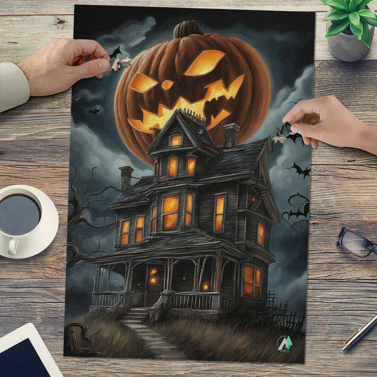 Pumpkin Manor puzzle featuring a pumpkin-topped house, crafted from premium ivory cardboard. Available in 500 and 1000 pieces, showcasing artwork by @crazydancingguy.