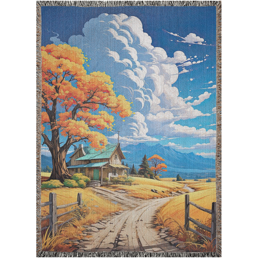 Rustic Idyll Woven Blanket features a scenic house, road, and tree design, adding luxury and personality to home décor.